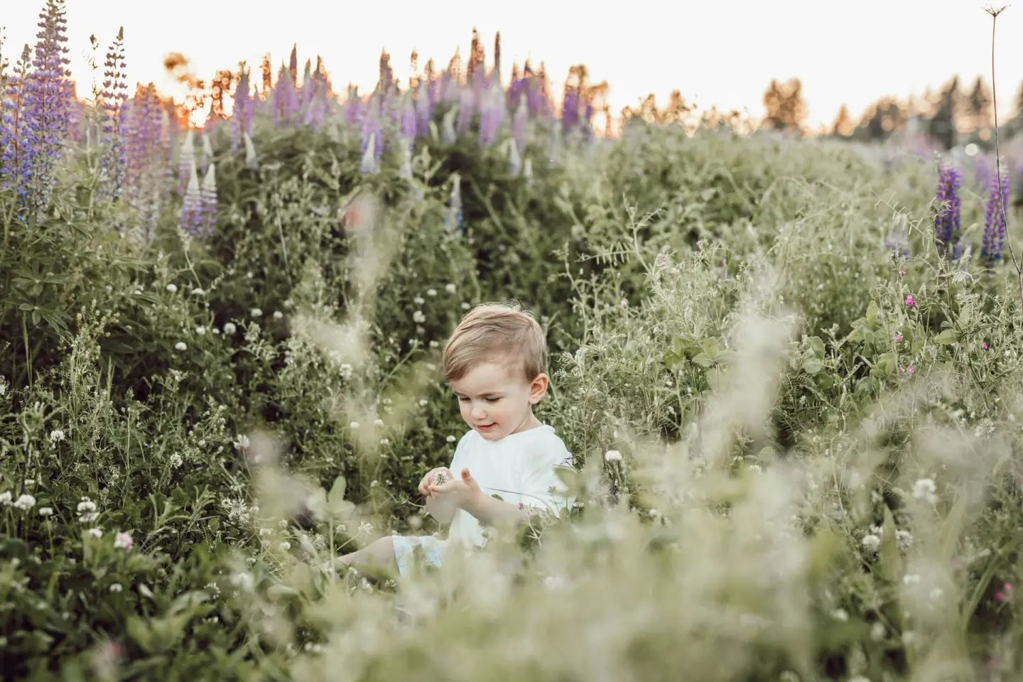 child-surrounded-by-plants